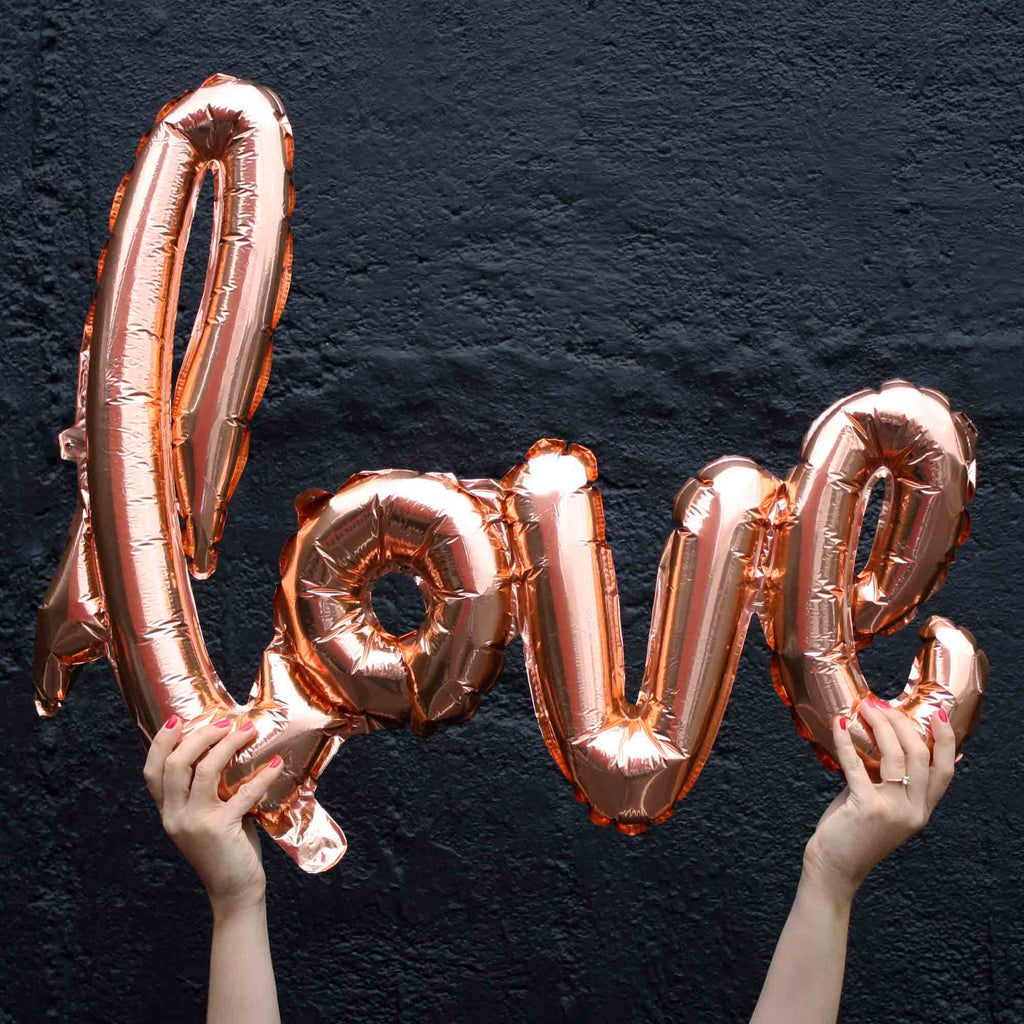 love balloons script in rose gold engagement party