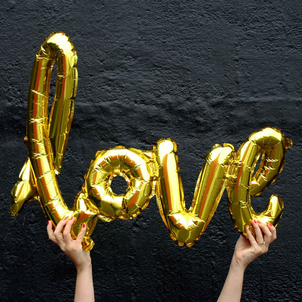 Script love balloons in gold